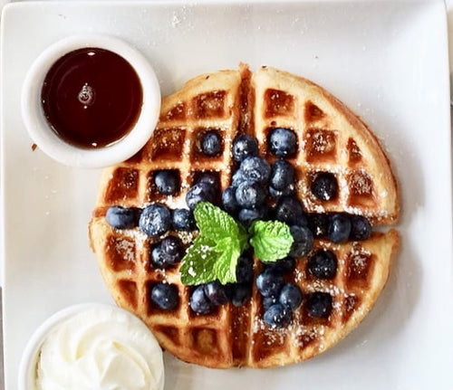 Belgian waffles with blueberries.